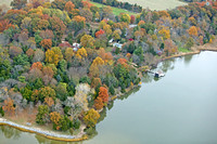 Autumn Colors Surround a Boathouse on Woodland Creek