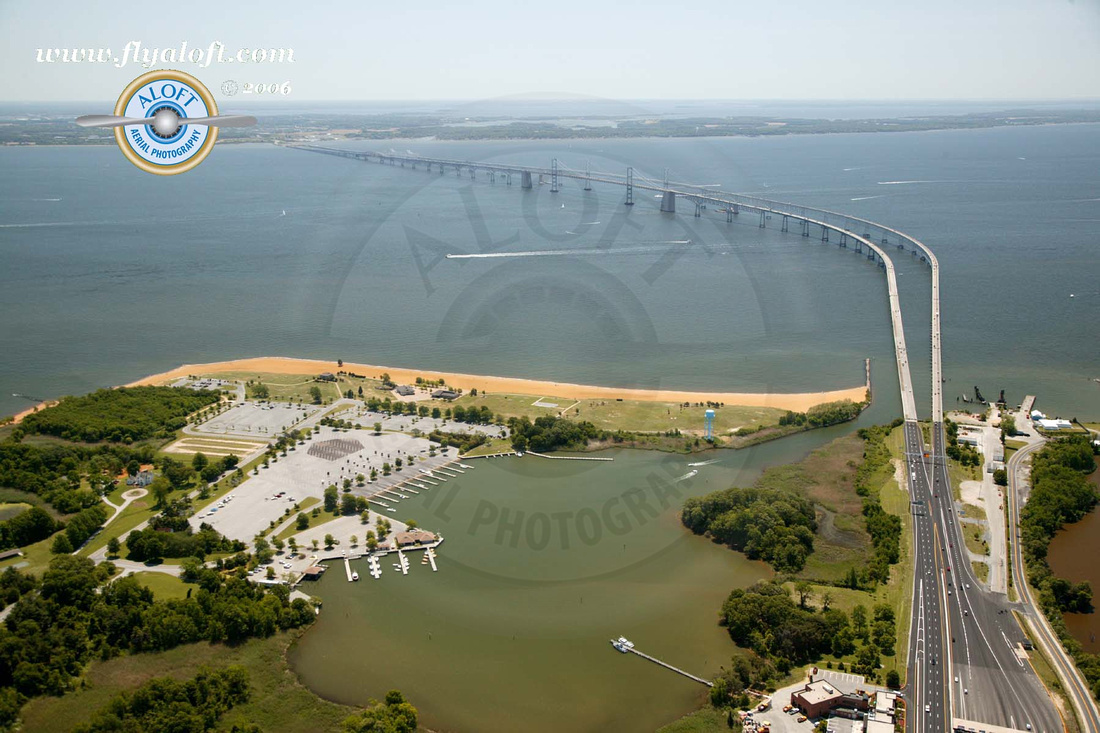 A shot of the Chesapeake Bay Bridge taken from the Western Shore of Maryland with a view of Mezick Ponds in the lower left corner.