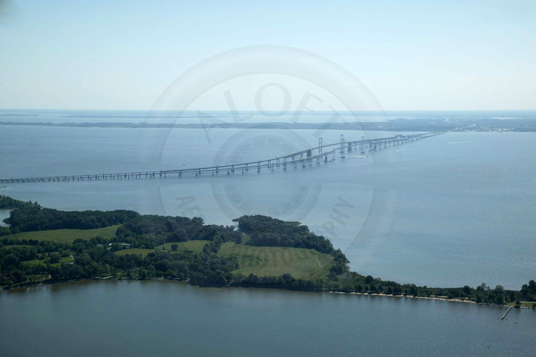 The Chesapeake Bay Bridge in August shot from Whitehall Creek near Hackett Point on the Western Shore of Maryland. Visible is the entire Bay Bridge, Goose Pond, Moss Pond, Love Point, and the mouth of the Chester River. 